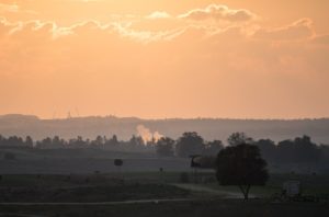 Photo: Smoke rises from a fallen rocket fired from Gaza in a field in southern Israel near the border, Nov. 13, 2018. (Hadas Parush/Flash90)