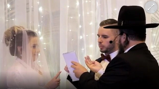 The rabbi was married to deaf couples in sign language